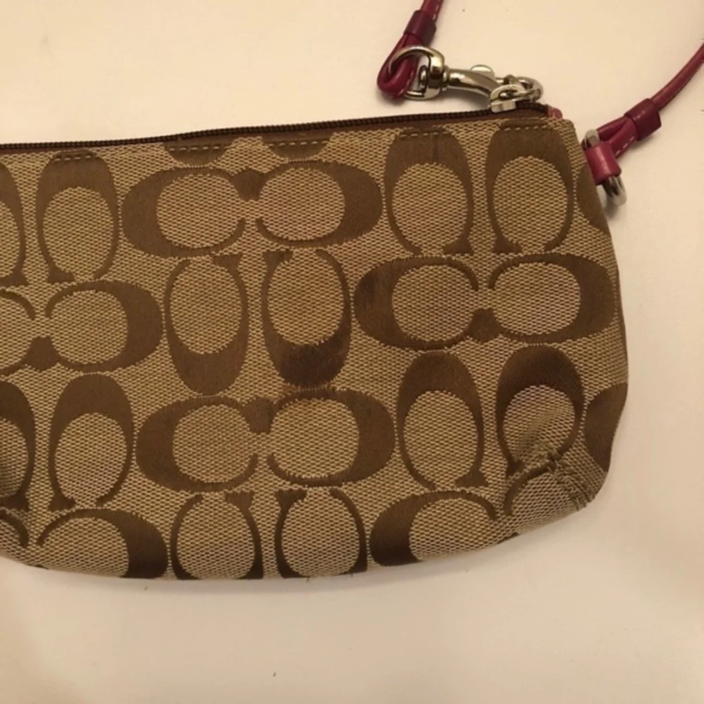 Coach signature brown dark pink leather wristlet
